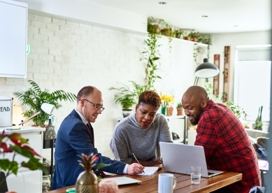 Couple in Kitchen with Advisor